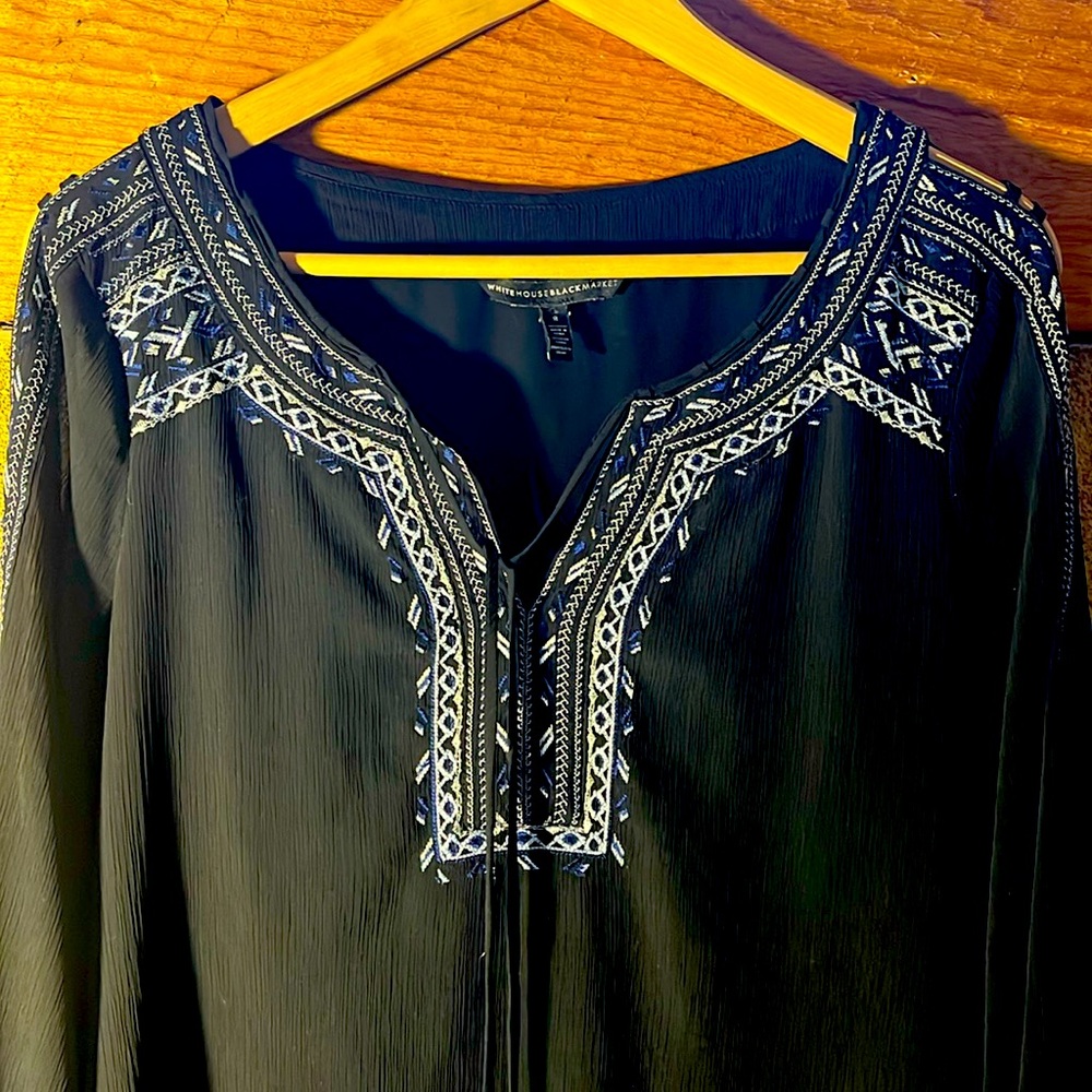 Black sheer overlay embroidered blouse.